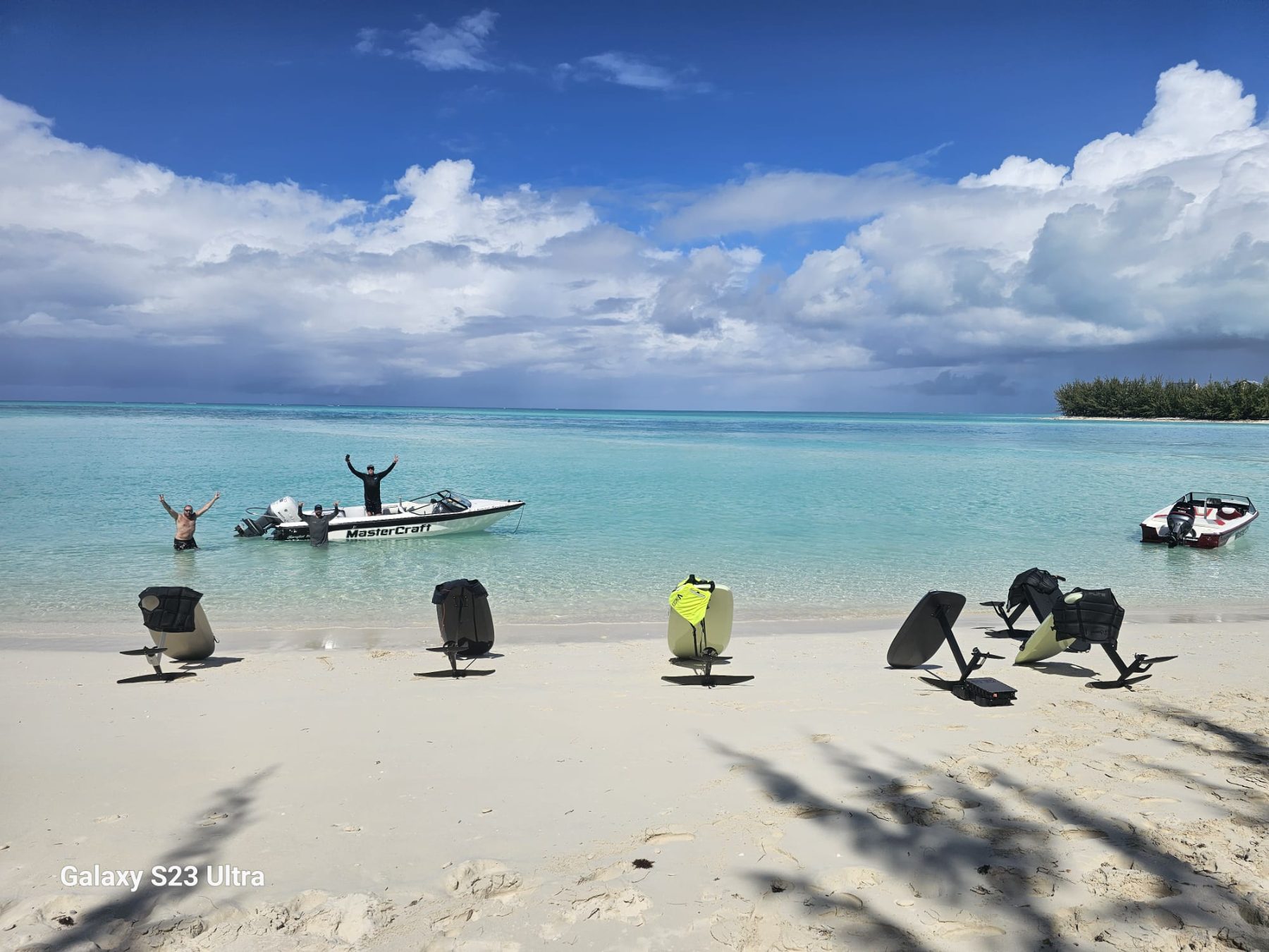 Fliteboards lined up on the sand with the Mastercraft offshore